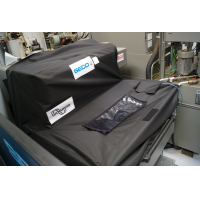 La tapa del depósito del transportador de máquina Wogaard para centros de mecanizado.